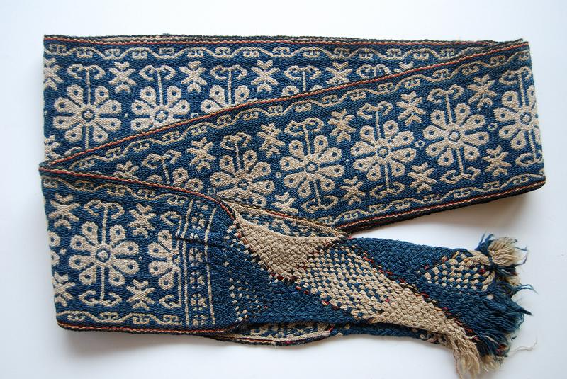 A very fine example of a man's woven wool belt using indigo dye.