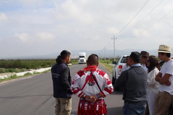 Mexican human rights and Wixárika delegates observe the passing of egg cargo from the new industrial plants. Photography by Author, 2022.