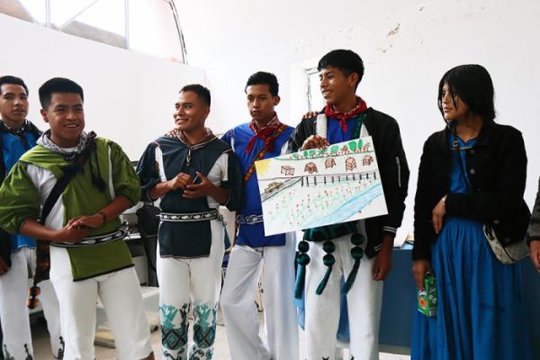 Students presenting their designs for the location of the beehives